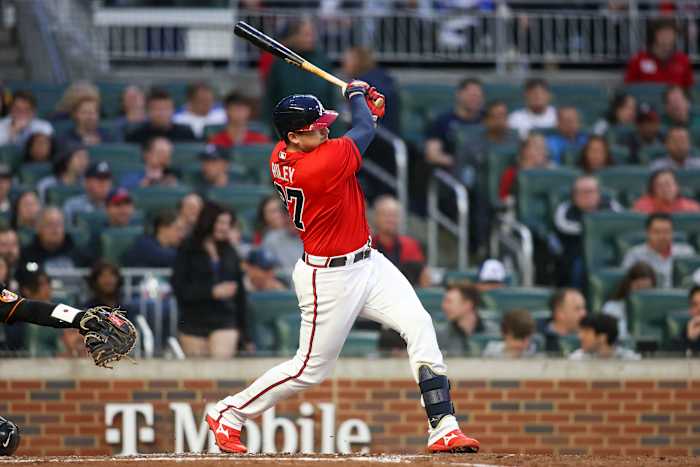 May 5, 2023; Atlanta, Georgia, USA; Atlanta Braves third baseman Austin Riley (27) hits a single against the Baltimore Orioles in the third inning at Truist Park.